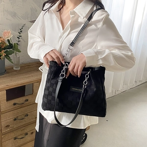 Large capacity black tote bag with checkered panel and chain straps for daily commute