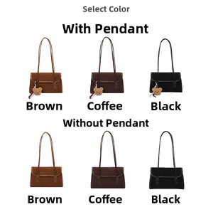 Selection of vintage suede shoulder bags in brown, coffee, and black with bear pendants