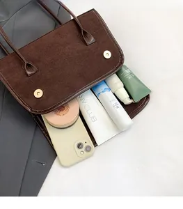 Internal view of brown corduroy shoulder bag showing spacious storage for daily items