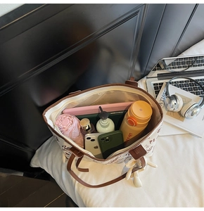 Spacious tote bag interior showcasing storage for tablets, umbrellas, and daily essentials