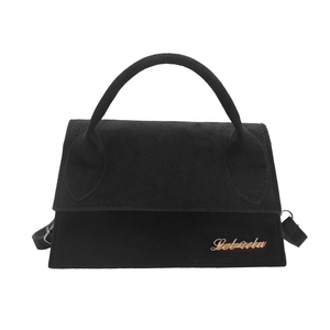 French style minimalist black suede crossbody bag with gold logo on white background