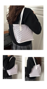 Three-side view of a casual tote bag with white leather trim and Y-pattern print on model