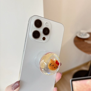 Detail of transparent air cushion phone grip with cute cat icon and gold glitters