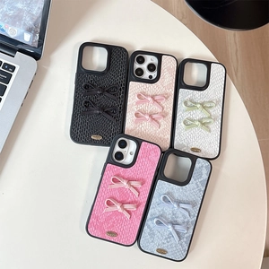 Snakeskin texture iPhone cases with 3D bows in black, pink, white, red and blue
