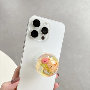 Detailed shot of a 3D bear air cushion phone grip with laser colorful tulip effect