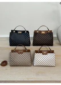 Detailed display of four plaid crossbody bags in black, brown, and beige with metal locks