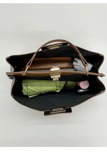 Top view of brown tote bag showing large capacity with double layer interior and metal buckle