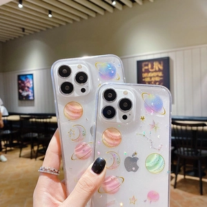 Close-up of glitter star pattern and moon design on a transparent phone case for iPhone