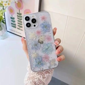Coque iPhone transparente avec de vraies fleurs séchées et des feuilles d'argent