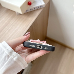 Close-up of precise cutouts for charging port and speaker on snake texture bow case