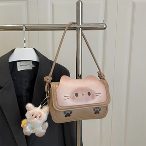 Cute cat-themed khaki and pink crossbody bag with a plush bear charm for winter