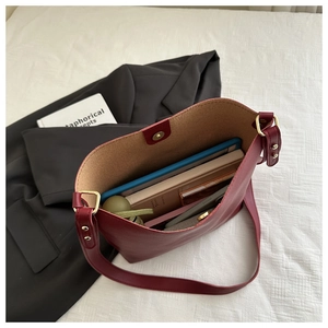 Interior view of burgundy leather tote bag showing large capacity for tablet and books
