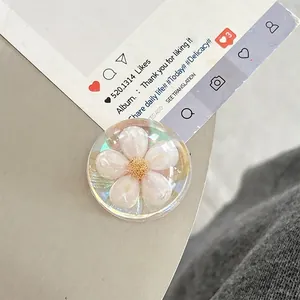 Detailed macro view of a clear resin phone socket with an embedded white pearl flower