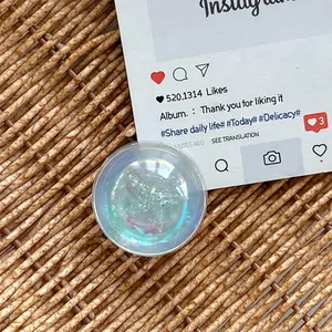 Macro detail of round holographic phone grip holder with glitter and gold flakes
