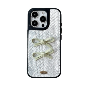 White snakeskin texture iPhone case with light green 3D bows and gold plaque