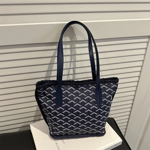 Classic dark blue tote bag with white geometric Y-pattern and leather handles for women