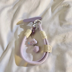 Detail of purple braided phone lanyard with cute star and smiling cloud pendants