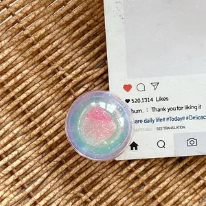 Detail of 3D resin heart phone grip with pink glitter and holographic gradient effect