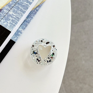 Detail of heart mirror phone grip featuring colorful sequins and mine text engraving