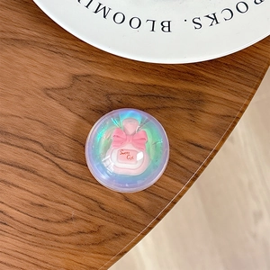 Close-up of laser crystal phone socket featuring pink perfume bottle and Sweet Girl bow