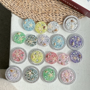 Sparkly ocean themed phone socket grips with starfish and seashell designs in vibrant colors