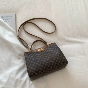 Elegant retro women's shoulder bag with brown monogram pattern and gold swivel clasp