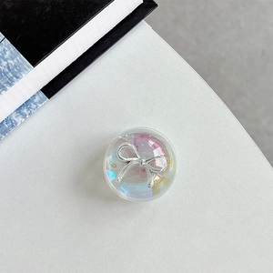 Macro shot of an aurora crystal heart phone grip with a 3D silver bow accent