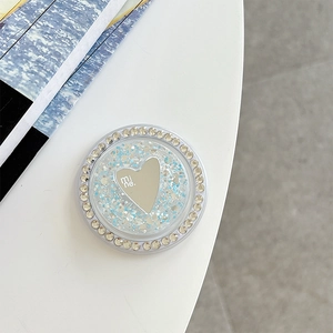 Macro shot of silver heart phone socket with glitter finish and rhinestone border