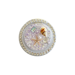 Round ocean style phone grip with seashells, starfish, and purple glitter sequins