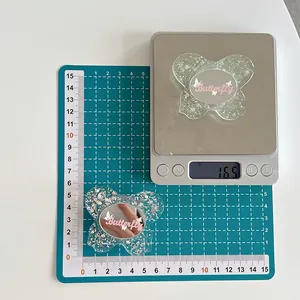 Detail shot showing the 16.5g weight and dimensions of the glitter butterfly phone grip
