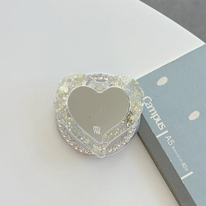 Détail du support magnétique cœur pour téléphone avec paillettes, miroir et strass