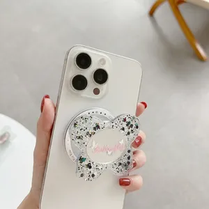 Glittery butterfly phone socket mirror with pink butterfly text on a white smartphone