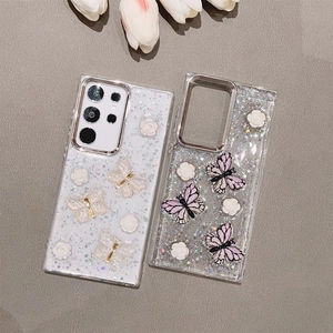 Detail showing 3D resin roses and glitter butterfly charms on clear Samsung Galaxy case