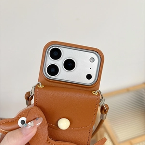 Close-up of brown litchi leather phone case with card slot and cute dog charm attachment