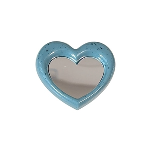 Blue heart-shaped phone mirror socket with terrazzo spots and metallic reflective surface