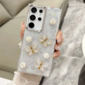 Macro detail of 3D rose and butterfly charms on glittery Samsung S24 Ultra phone case