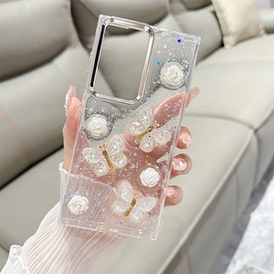 Detail view of transparent glitter phone case with 3D white butterflies and roses