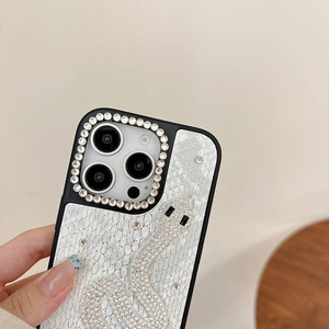 Close-up of the silver snake rhinestone design on off-white leather iPhone case