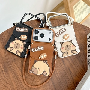 Cartoon capybara phone case with wallet and lanyard for iPhone, wood desk setting