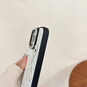 Detail of luxury rhinestone snake pattern on premium leather texture phone case cover