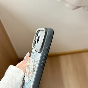 Detailed side view of iPhone case with luxury blue snake pattern and crystal rhinestones