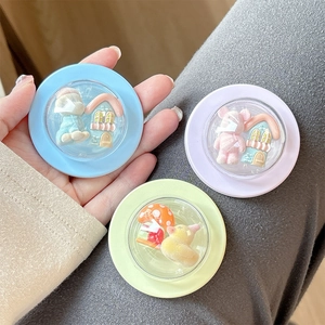 Close-up of pastel cartoon 3D bear and duck telescopic phone grips in macaron colors