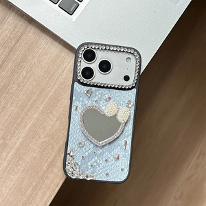 Macro detail of luxury snake skin texture iPhone case with rhinestone heart mirror