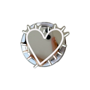 Silver metallic heart phone grip mirror with stylish radial textured edge on white background