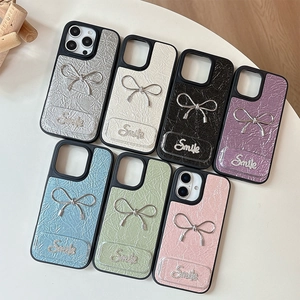 Litchi leather iPhone case with metal bow and diamond smile design in 7 colors