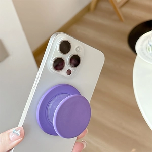 Deep purple magnetic pop-out phone socket holder on white smartphone in minimalist style