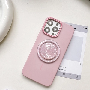 Close-up of pink MagSafe phone case with shell texture inlay and matte silicone finish
