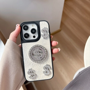 Detail of luxury leather iPhone case featuring sparkling rhinestone dollar sign metal charms