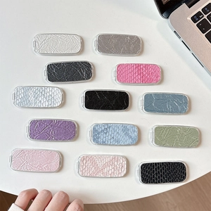 Sleek faux snakeskin and crocodile pattern adhesive phone mirror stands in assorted colors