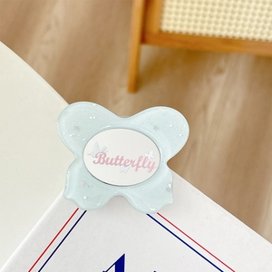 Light blue glittery butterfly phone grip with silver stars and pink text detail